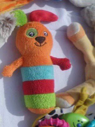 Peluche hochet orange à rayures