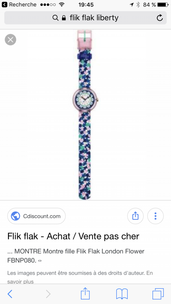 Montre Flik Flak bleue Avec des petites fleurs Liberty square De l évêché ou dans le gazon en face du parc Et devant Les appart hotel