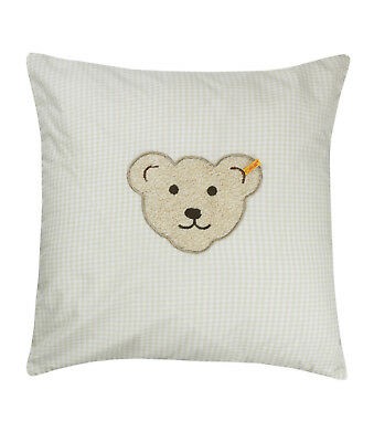 perdu un oreiller rose pâle avec un dessin d'ourson beige